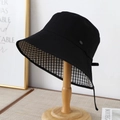 Black bucket hat with houndstooth lining and adjustable drawstring on a wooden stand - M (56-58cm) / Double-sided Black