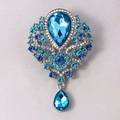 Vintage silver brooch with blue crystal floral cluster and teardrop pendant charm - Light Blue