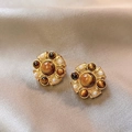 Detail of vintage round tiger eye earrings with pearls on beige satin background - 21# Flower Resin Pearl Stud Earrings with Silver Earring Post