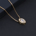 Detail view of a gold-plated necklace with marquise and round-cut zirconia stones - White