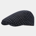 Close-up of classic navy blue plaid newsboy cap featuring breathable checkered cotton fabric - Adjustable / Dark Blue