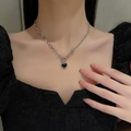 Hip-hop silver necklace with black heart pendant and pin element worn by model - Silver Stainless Steel Chain (Black Heart Pendant)