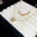 Macro shot of 18k gold plated double layer necklace with cubic zirconia cylinder pendant - Necklace-Gold (18K Real Gold Plated)