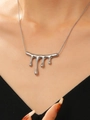 Silver liquid lava drip pendant necklace with snake chain worn by a female model - Stainless Steel Irregular Lava Drop Necklace (9382)