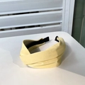 Pale yellow leather headband with cross-knot design and elastic black ends - Pale Goose Yellow