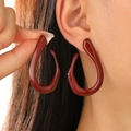 Deep red geometric enamel oval earrings worn by model for elegant party styling - Deep Red Shiny Comma Earring (A-290)