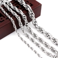 Detail of four silver twisted rope chains in varying widths on a dark wood box - Rope Necklace / Extra Wide Lobster Clasp Style