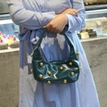 Dark green glossy leather hobo bag with gold stud rivets and semi-circular handle - Malachite green