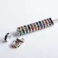 Macro shot of silver plated rondelle spacer beads with colorful rhinestones for DIY jewelry - 6mm / Silver Plated Mixed Color Rhinestone
