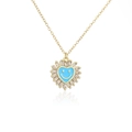 Detail van een gouden hart hanger met blauwe emaille smiley en zirkonia afwerking - Blauw