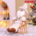 Père Noël champagne assis sur chaise à bascule, 30cm ornement de Noël festif et élégant - Père Noël en chaise à bascule