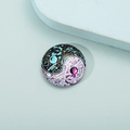 Detailed macro view of a circular glass mandala magnet with yin yang butterfly motif - Style 3/Tai Chi Butterfly