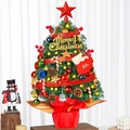 Detailed view of a mini 50cm Christmas tree with red berries, pine cones and warm lights - SYT314
