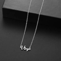 Silver stainless steel zodiac necklace featuring a Virgo pendant on a sleek black stand - Virgo Steel