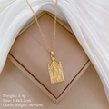Gold Virgin Mary pendant necklace with micro-inlaid stones on a beige jewelry box - Virgin Mary Church Window Design Style (A129)