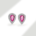 Close-up of pink pear-shaped gemstone earrings with white zircon halo on silver setting - 925 Silver / Ruby Red (July)
