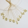 Polished 18k gold plated puffy alphabet pendant necklaces on white display - 14k / Letter J