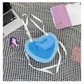 Blue heart-shaped shoulder bag with transparent window and white strap in casual setting - Light Blue