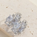 Elegant silver square zircon hoop earrings displayed on a minimalist stone surface - White Zirconia (Silver)