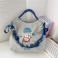 Light gray nylon tote bag with bear embroidery and blue rope handle on desk - Light Grey Bear Flute (No Strap)
