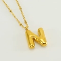 Puffy letter N pendant necklace in 18K gold plated stainless steel on white background - Letter N / Gold