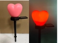 Pink heart solar garden stake light with red glow effect in day and night view - Single Heart Pink