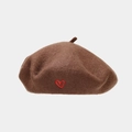 Close-up of wool beret in dark brown featuring a small red embroidered heart detail - One Size / Dark Brown