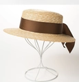 Detailed close-up of a natural straw boater hat featuring a brown satin ribbon and bow - 7cm Coffee Ribbon