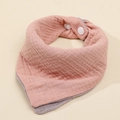 Detail of a dual-sided pink and grey cotton gauze baby bib with secure white snap buttons - Deep Pink + Deep Purple
