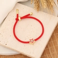 Detail of red braided evil eye bracelet with a gold star charm on stone background - Red Woven Rope Evil Eye Five-Pointed Star Style (4#绳子)