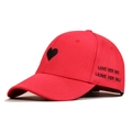 Detail of love quote embroidery on red cotton baseball cap with heart pattern - Red
