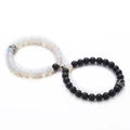Macro view of 8mm white opal and black lava stone couple bracelets with magnetic crowns - 04-Opal & Frosted Stone