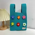 Teal knitted tote bag with colorful 3D flowers for daily commute and casual style - Colorful Little Flowers Blue