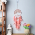 Pink Tree of Life dreamcatcher with natural feathers hanging on a light blue wall - 9447B Pink Tree of Life / Pink
