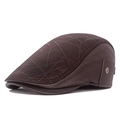 Dark brown leather newsboy cap for men featuring geometric prints and metal side buckles - Coffee