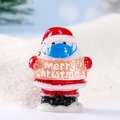 Miniature resin Santa Claus figurine with blue face mask and Merry Christmas sign - Santa Claus with Mask