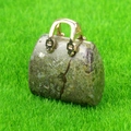 Miniature green jasper stone handbag pendant with golden handles on green grass background - Dragon Blood Stone