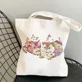 White canvas tote bag featuring a colorful floral cat print and long shoulder handles - C7 Artistic Cat
