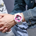 Close-up of white silicone unicorn sports watch with pink dial on wrist in street style - White Pink