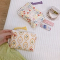 Detail of floral and vintage print cotton coin pouches with zippers and colorful drawstrings - Flower in Mirror