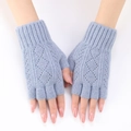 Detail of light blue knit arm warmers with diamond pattern and ribbed fingerless cuffs - One Size / Light Blue