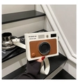 Detail of vintage camera-style crossbody bag with influencer lens design and brown accents - White