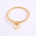Golden heart charm bangle with letter X and twisted cable band for women - Letter X