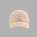 Close-up of pink bow embroidery detail on a khaki cotton baseball cap texture - Bow Embroidered Baseball Cap Style / Khaki
