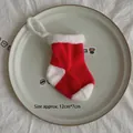 Mini red and white knitted Christmas sock hanging ornament measuring 12cm by 7cm - Red White Patchwork Large Sock