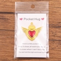 Pocket Hug Heart red enamel pendant with gold wings on a sentiment message card - Gold Radiant Wings Heart