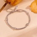Detail view of silver double-layer stainless steel snake and rope chain bracelet - Steel Round Beads