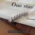 Elegant silver twisted metal spring hair clip 7.5cm long with polished mirror finish - Twisted Silver