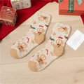 Coral fleece Christmas socks featuring beige gingerbread man pattern on wooden floor - Khaki