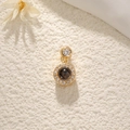 Golden dreamcatcher projection necklace with gemstone and crystals on textured background - Round Bead